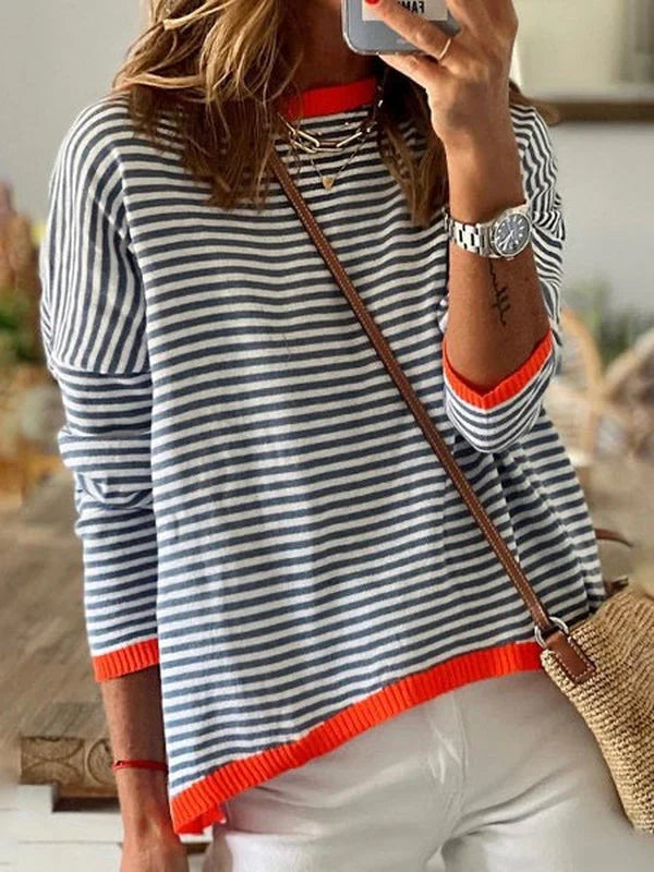 Navy blue and white striped long-sleeved top with orange trim