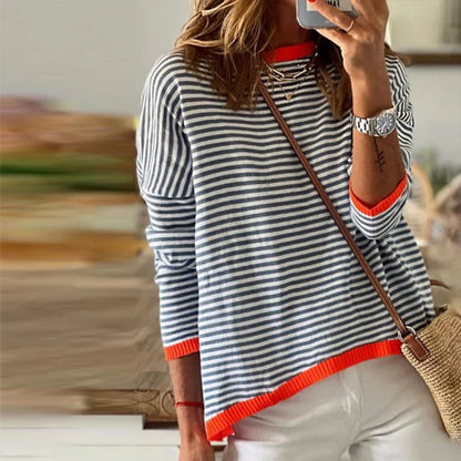 Navy blue and white striped long-sleeved top with orange trim